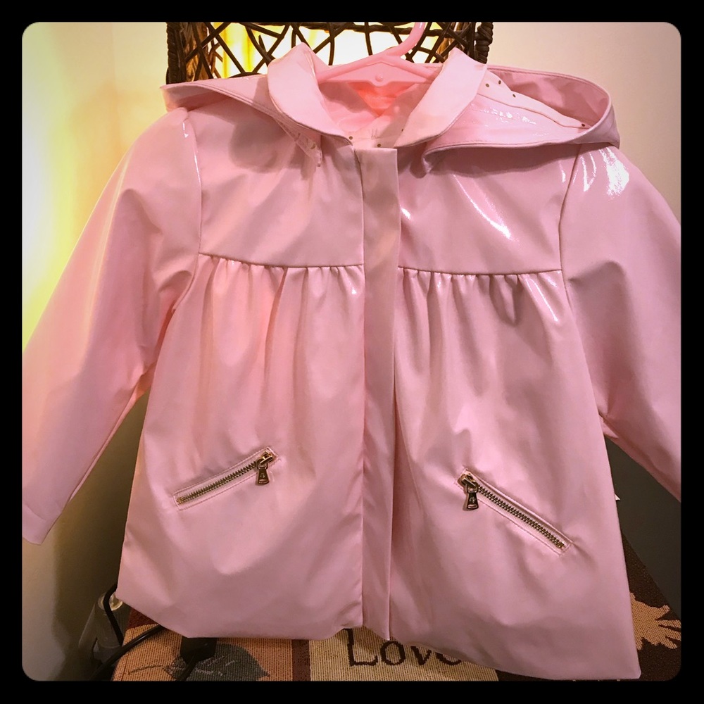Toddler girl’s raincoat. Designed in France .